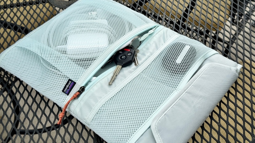 the refugio's removable tech caddy has some extra pockets for your...