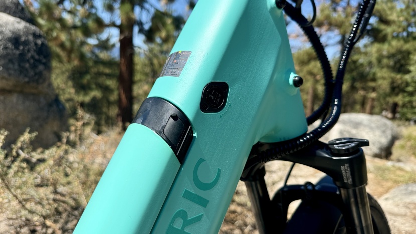 a lockable battery integrates into the downtube and allows users to...