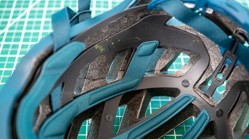 after impact testing, we found that some helmets had cracked inner...