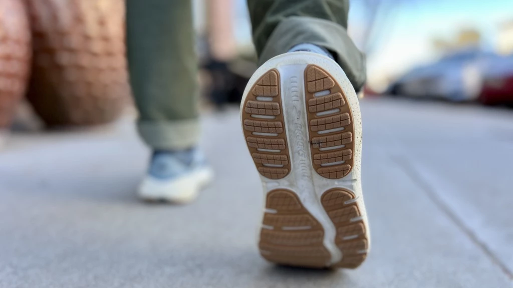 Woman testing various walking shoes during outdoor gear testing session