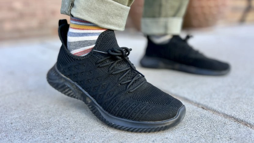 Close-up comparison of walking shoe features including cushioning, arch support, and sole construction