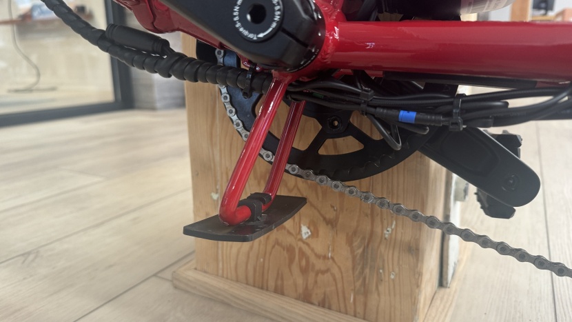 this bar supports the bike in its folded position and prevents it...