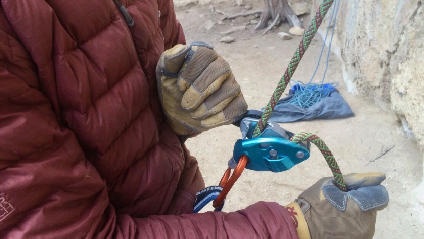 petzl grigri - lowering with the grigri requires opening the retractable handle in...