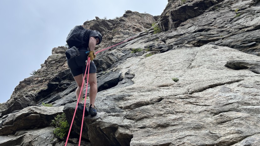 rappelling off a multi-pitch route with a tube-style device.