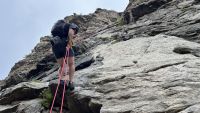 Rappelling off a multi-pitch route with a tube-style device.