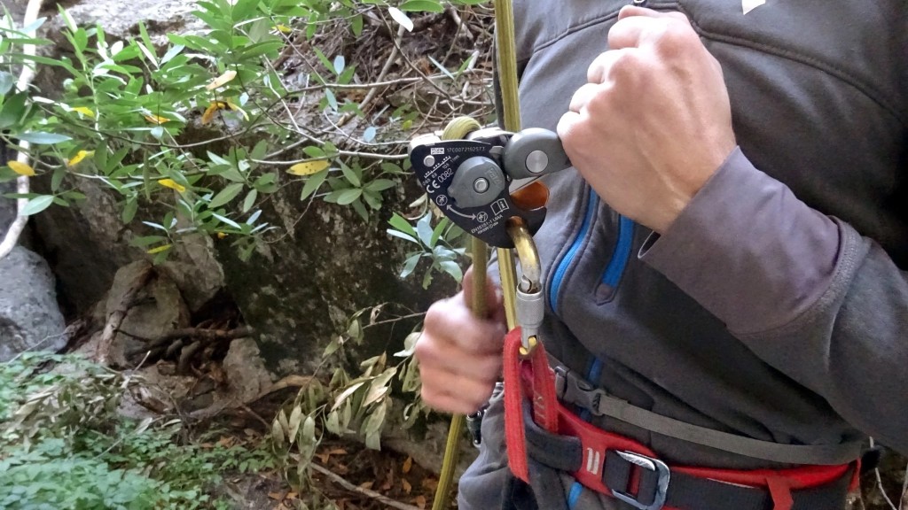 belay device - lowering a climber safely and smoothly to the ground with the...