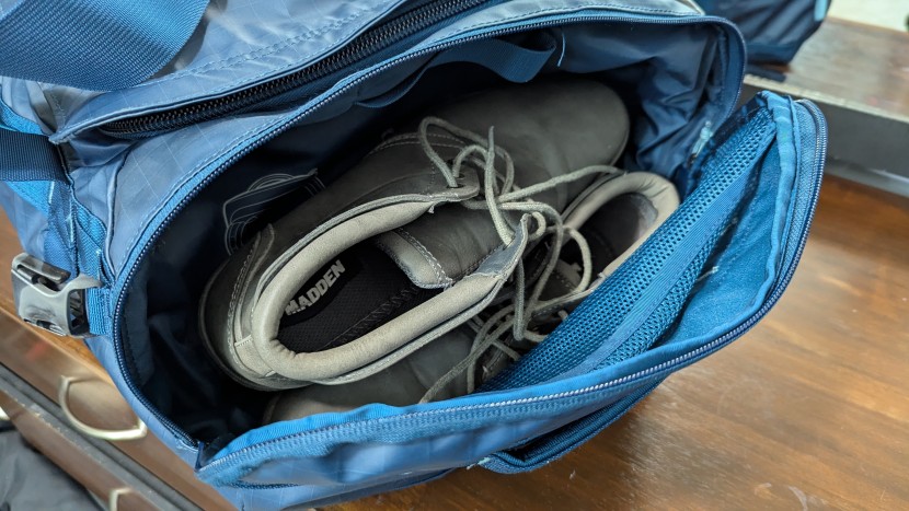 the north face base camp voyager duffel - we easily fit a pair of high-top shoes in the side compartment, and...