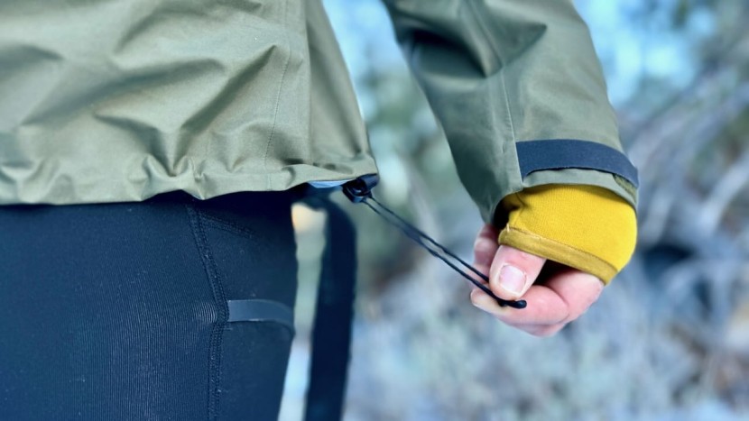 the design features an adjustable drawcord at the hemline of the...