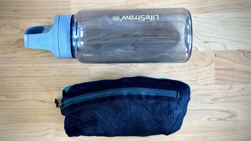 the jacket stows into one of the perforated pockets, packing down...