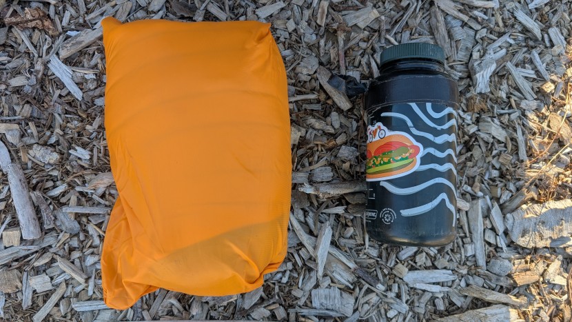 stio pinion hooded - the pinion packs into its chest pocket to a small, packable size.