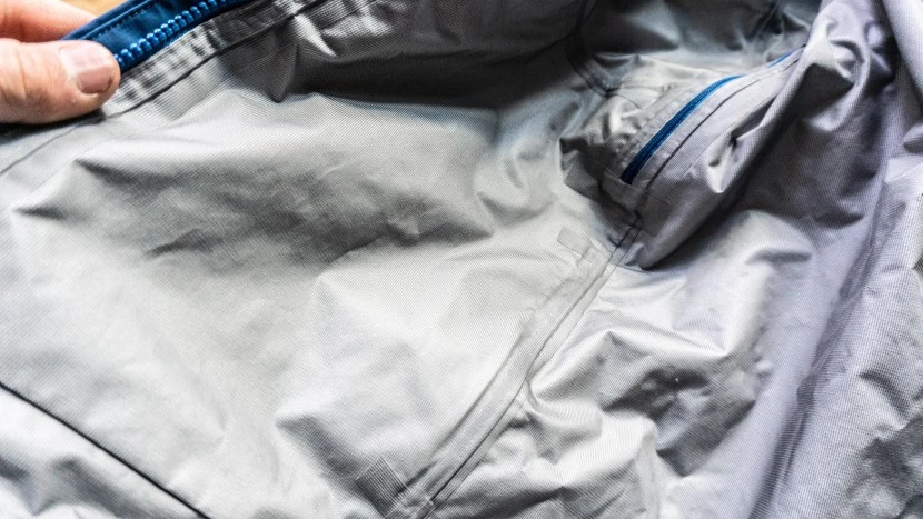 Close-up view of waterproof jacket construction showing sealed seams and technical details