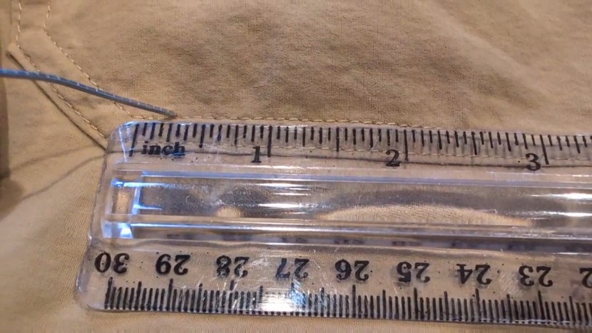 using a ruler to count stitches per inch.