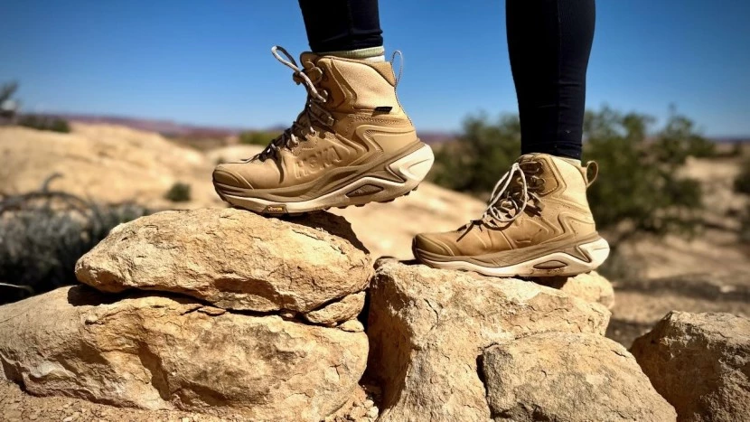 Hoka Kaha 3 GTX hiking boots on rocky terrain showing durability and traction