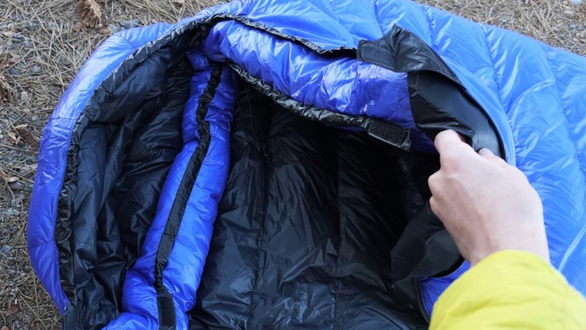 backpacking sleeping bag - the draft collar inside this bag uses an elastic drawstring to snug...