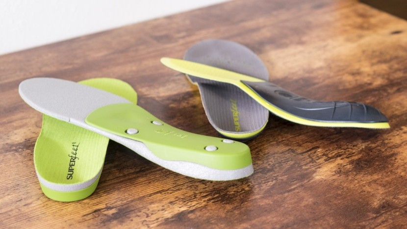 ski boots - aftermarket insoles, like those readily available from superfeet...
