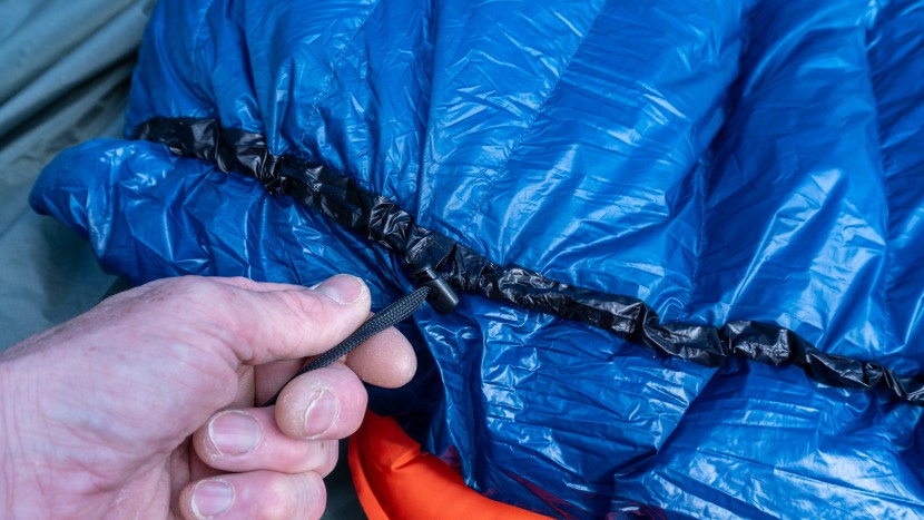 the top neck area has a simple cinch to keep the quilt close to your...