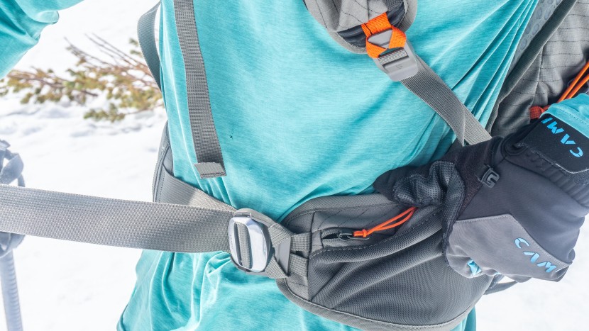 on one side, the hip belt has a large storage pocket, on the other...