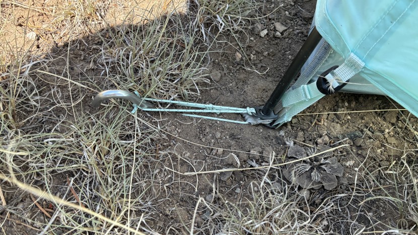 backpacking tent - two metal taps attach the tent and footprint to the poles. the...