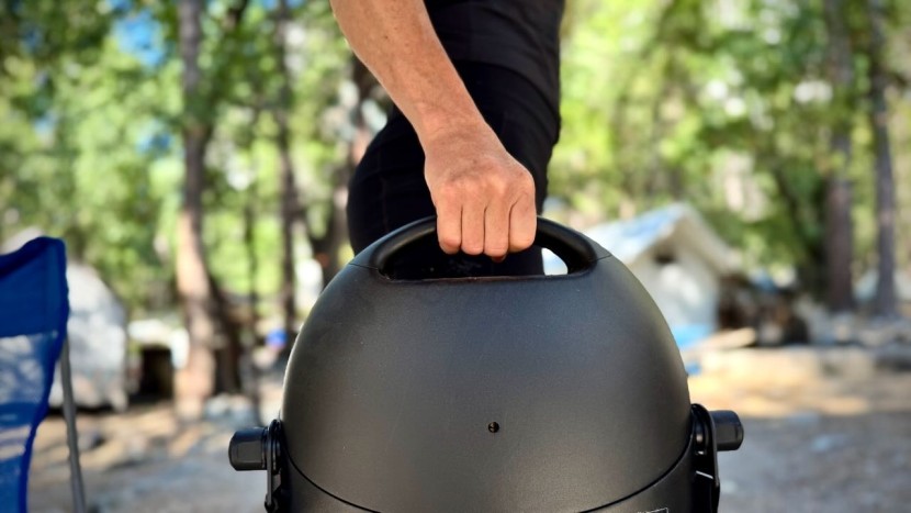 the ergonomic handle located on the top of the grill for portability.