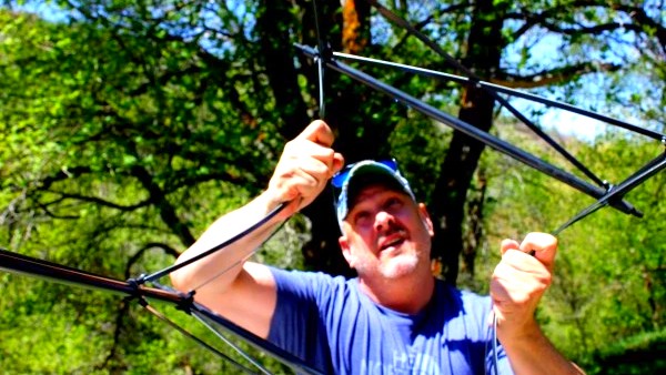 camping table - bending one of our table&#039;s frames to test its strength.