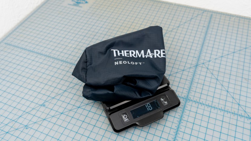 the included stuff sack comes in at .6 ounces / 18 grams.