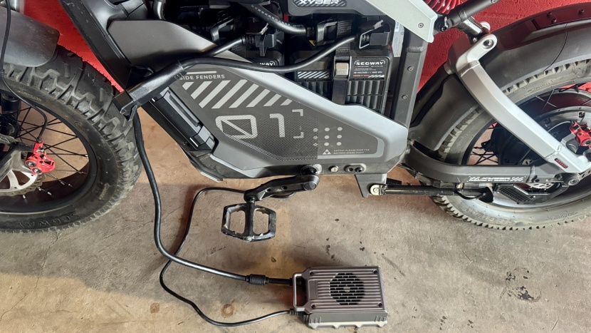 segway xyber - the 10-amp fast charger is large and heavy; here you see it charging...