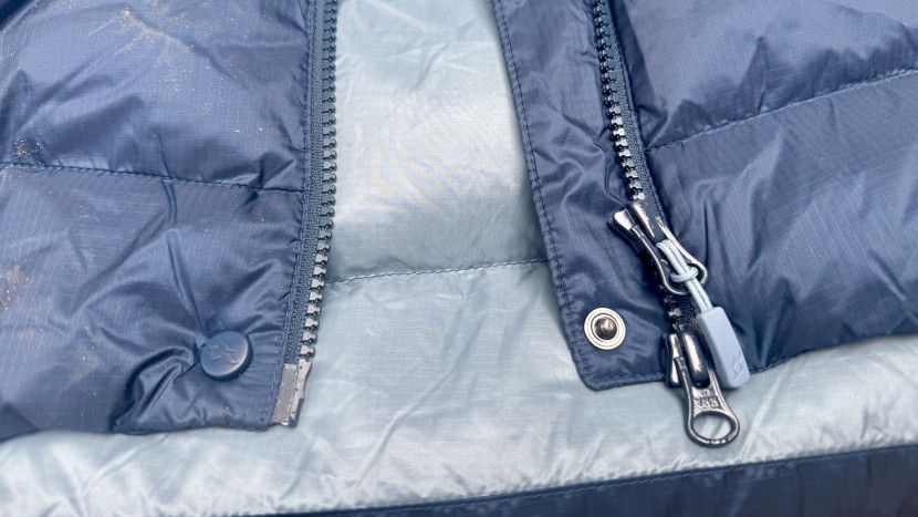 rab neutrino pro for women - the updated jacket has a snap button to help seal the zippers&#039; storm...