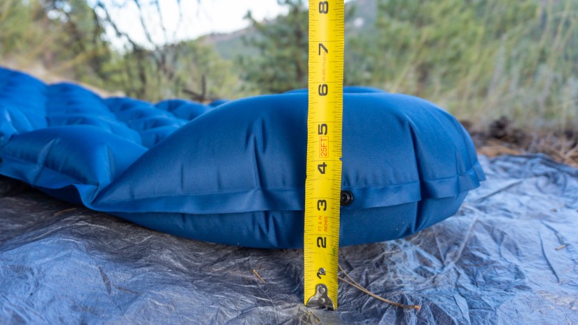 the built-in pillow is much thicker, at approx. 5 inches.